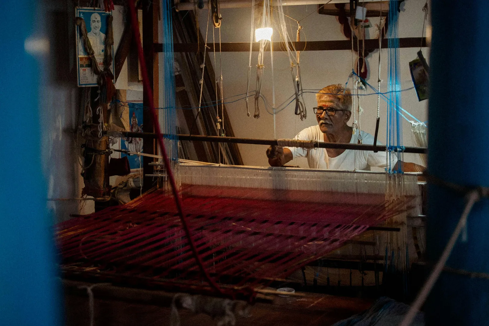 Indian weaver working on a traditional handloom